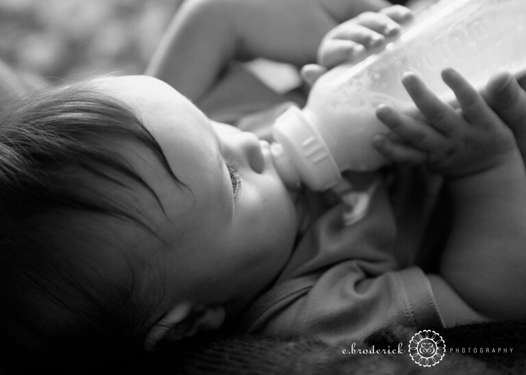 A baby and her bottle. 