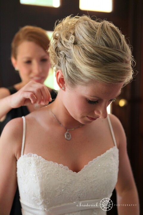 Lindsay puts on Shelby's necklace. 