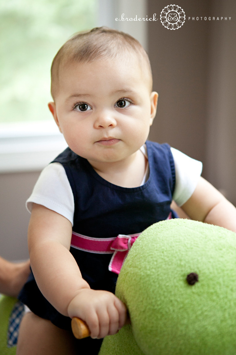 Mia hanging out on her rocking horse. (Or dinosaur, I think?!)